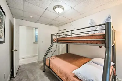 a bedroom with two bunk beds in a room at Lancaster Unit with Expansive Covered Porch! in Lancaster