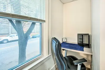 a desk and a chair in a room with a window at Lancaster Unit with Expansive Covered Porch! in Lancaster