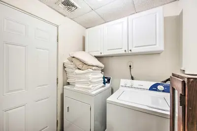a white laundry room with a washer and dryer at Lancaster Unit with Expansive Covered Porch! in Lancaster