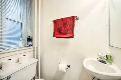 a bathroom with a sink and a red towel at Lancaster Unit with Expansive Covered Porch! in Lancaster
