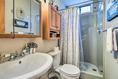 a bathroom with a sink and a toilet and a shower at Walk to Locust Lake Poconos Vacation Home! in Pocono Lake