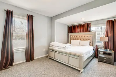 a bedroom with a bed and a window at Updated Linden Home Visit NYC and Newark! in Linden