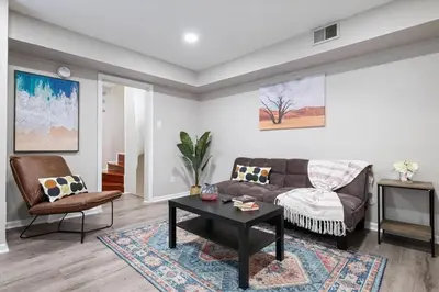 a living room with a couch and a table at Newly Built 2 Bdrm-By Philly Center City in Philadelphia