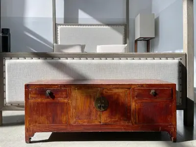 a wooden dresser sitting in front of a mirror at Duplex Suite in Art Tower in Philadelphia