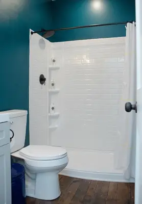 a bathroom with a toilet and a shower at Bischoff Inn - Former 1870 Furniture Factory Now 5 Room Boutique Hotel in Tamaqua