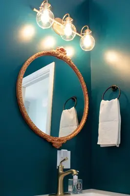 a bathroom with a mirror and a sink at Bischoff Inn - Former 1870 Furniture Factory Now 5 Room Boutique Hotel in Tamaqua