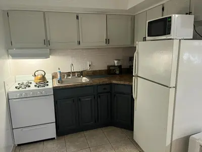 a kitchen with white appliances and a white refrigerator at Two Bedroom Private Apt near NYC in West New York
