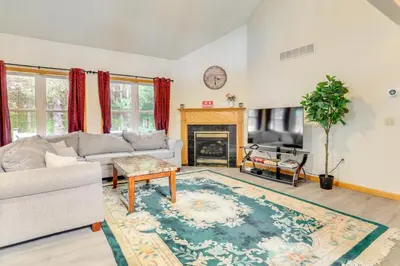 a living room with a couch and a fireplace at Game Room Poconos Family Home 13 Mi to Skiing! in Tobyhanna