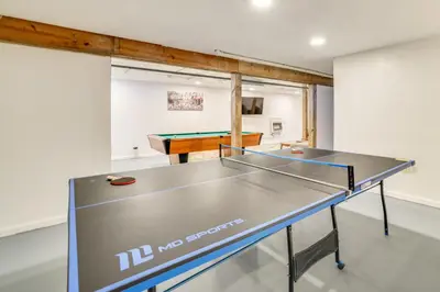 a ping pong table in a room with a ping pong ball at Game Room Poconos Family Home 13 Mi to Skiing! in Tobyhanna