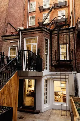 a building with two balconies on the side of it at Outsite Chelsea in New York