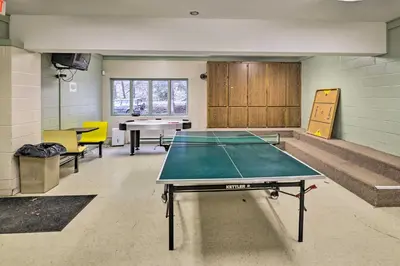 a ping pong room with a ping pong table at Hot Tub and Deck Pet-Friendly Poconos Getaway! in Bushkill