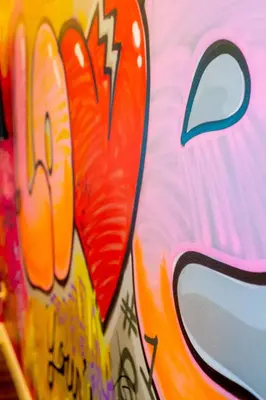 a close up of a wall with graffiti on it at Art Deco Graffiti Suite in Philadelphia