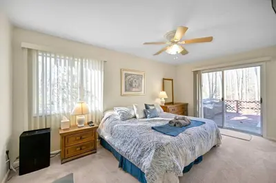 a bedroom with a bed and a ceiling fan at Pocono Pines, Lake Naomi 4 bedrooms, 2 full bath in Pocono Pines