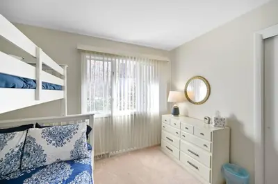 a bedroom with a bunk bed and a mirror at Pocono Pines, Lake Naomi 4 bedrooms, 2 full bath in Pocono Pines