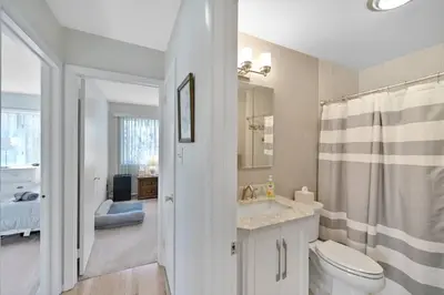 a bathroom with a toilet and a sink and a shower at Pocono Pines, Lake Naomi 4 bedrooms, 2 full bath in Pocono Pines
