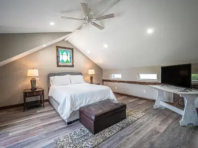 a bedroom with a bed and a ceiling fan at 1786 Farm Cottage Honeymoon Suite Renovated 2022 in Chester