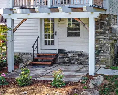 a white pergola in front of a house at 1786 Farm Cottage Honeymoon Suite Renovated 2022 in Chester