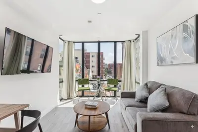 a living room with a couch and a table at Stay at Luna on N 11th St in Philadelphia