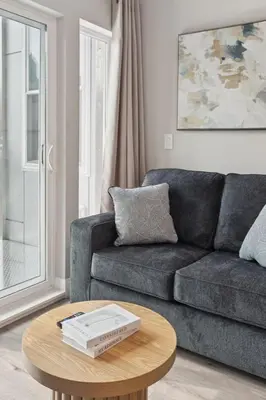 a living room with a couch and a table at Stay at Luna on N 11th St in Philadelphia