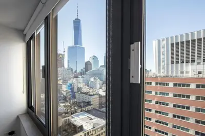 a view of a city skyline from a window at Tribeca Studio Indoor pool Great views NYC-185 in New York