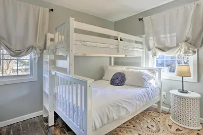 a white bunk bed in a room with a white bed at Bright Cornwall-On-Hudson Vacation Rental! in Cornwall-on-Hudson