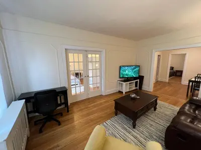 a living room with a couch and a television at Fantastic stay for 4 – Heart of Hoboken! in Hoboken