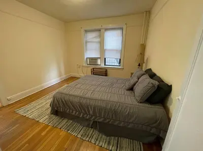 a bedroom with a large bed and a window at Fantastic stay for 4 – Heart of Hoboken! in Hoboken