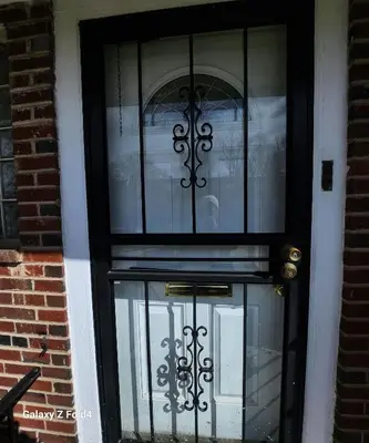 a black door with glass windows on a building at Cozy 2-bedroom Apartment in Philadelphia
