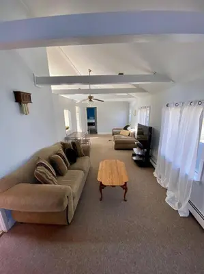 a living room with a couch and a coffee table at Peddlers Carriage house in New Hope