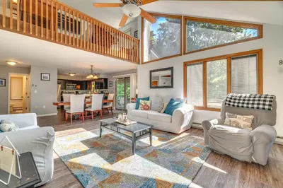 a living room with couches and a ceiling fan at Lake Harmony Home Near Big Boulder! in Lake Harmony