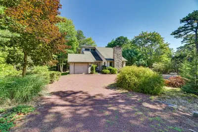 a house with a driveway in front of it at Lake Harmony Home Near Big Boulder! in Lake Harmony