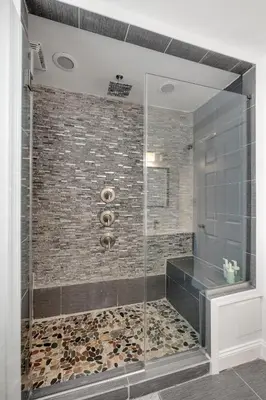 a shower with a glass door in a bathroom at Luxury 3BR Townhome - Northern Liberty in Philadelphia