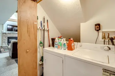 a kitchen with a sink and a refrigerator at Less Than 1 Mi to Ski Hill! Poconos Retreat with Game Room in Pocono Lake