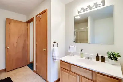 a bathroom with a sink and a mirror at Less Than 1 Mi to Ski Hill! Poconos Retreat with Game Room in Pocono Lake