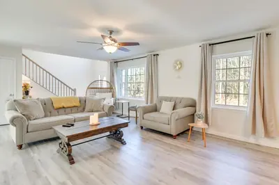 a living room with two couches and a table at 3 Mi to Kalahari Pocono Summit Home with Pool Table in Pocono Summit