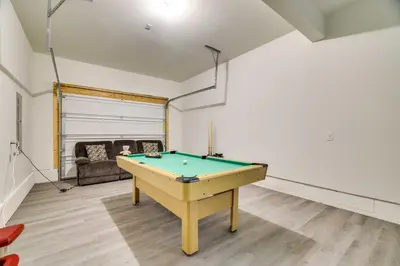 a pool table in a room with a couch at 3 Mi to Kalahari Pocono Summit Home with Pool Table in Pocono Summit
