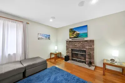 a living room with a couch and a fireplace at Poconos Peaceful Retreat - Families & Large Groups in Tobyhanna