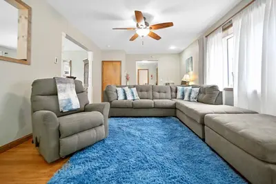 a living room with a couch and a ceiling fan at Poconos Peaceful Retreat - Families & Large Groups in Tobyhanna