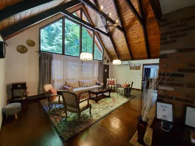 a living room with a couch and a table at Spacious Gateway, Walk to POOL & BEACH, Hot tub, Game room in Pocono Country Place