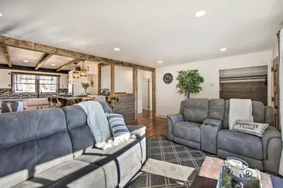 a living room with two couches and a table at Marietta Home with Private Hot Tub, Pool Table! in Marietta