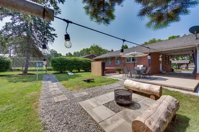 a backyard with a log bench and a house at Marietta Home with Private Hot Tub, Pool Table! in Marietta
