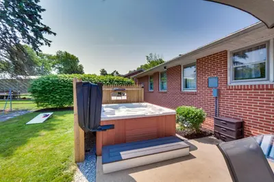 a hot tub in the backyard of a house at Marietta Home with Private Hot Tub, Pool Table! in Marietta
