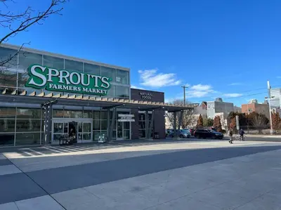 a store front of a farmers market on a street at Broad Street Apartment in Philadelphia