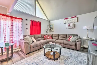a living room with a couch and a glass table at Tobyhanna Home Near Kalahari with Lake and Pool Access in Tobyhanna