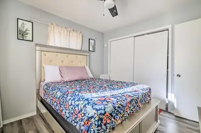a bedroom with a bed with a colorful quilt at Tobyhanna Home Near Kalahari with Lake and Pool Access in Tobyhanna