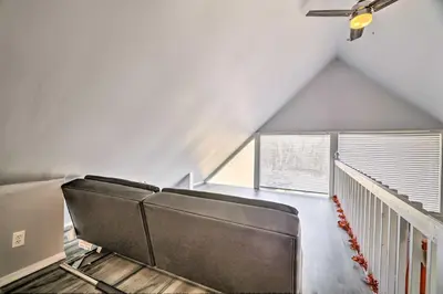 a room with a row of seats in a attic at Tobyhanna Home Near Kalahari with Lake and Pool Access in Tobyhanna