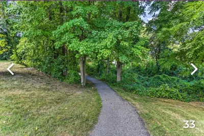 a walking path in a park with trees at Majesty mountains The Great spirit of Wakan Tanka in Vernon Township