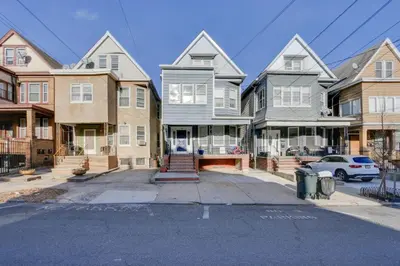 a row of houses on a street at Jersey City Apartment Near Liberty State Park in Jersey City