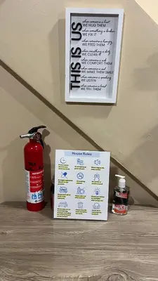 a fire extinguisher and a fire hydrant and a sign at The McNeil Mansions in Harrisburg