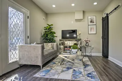 a living room with a couch and a tv at Newark Rental Near University of Delaware! in Newark